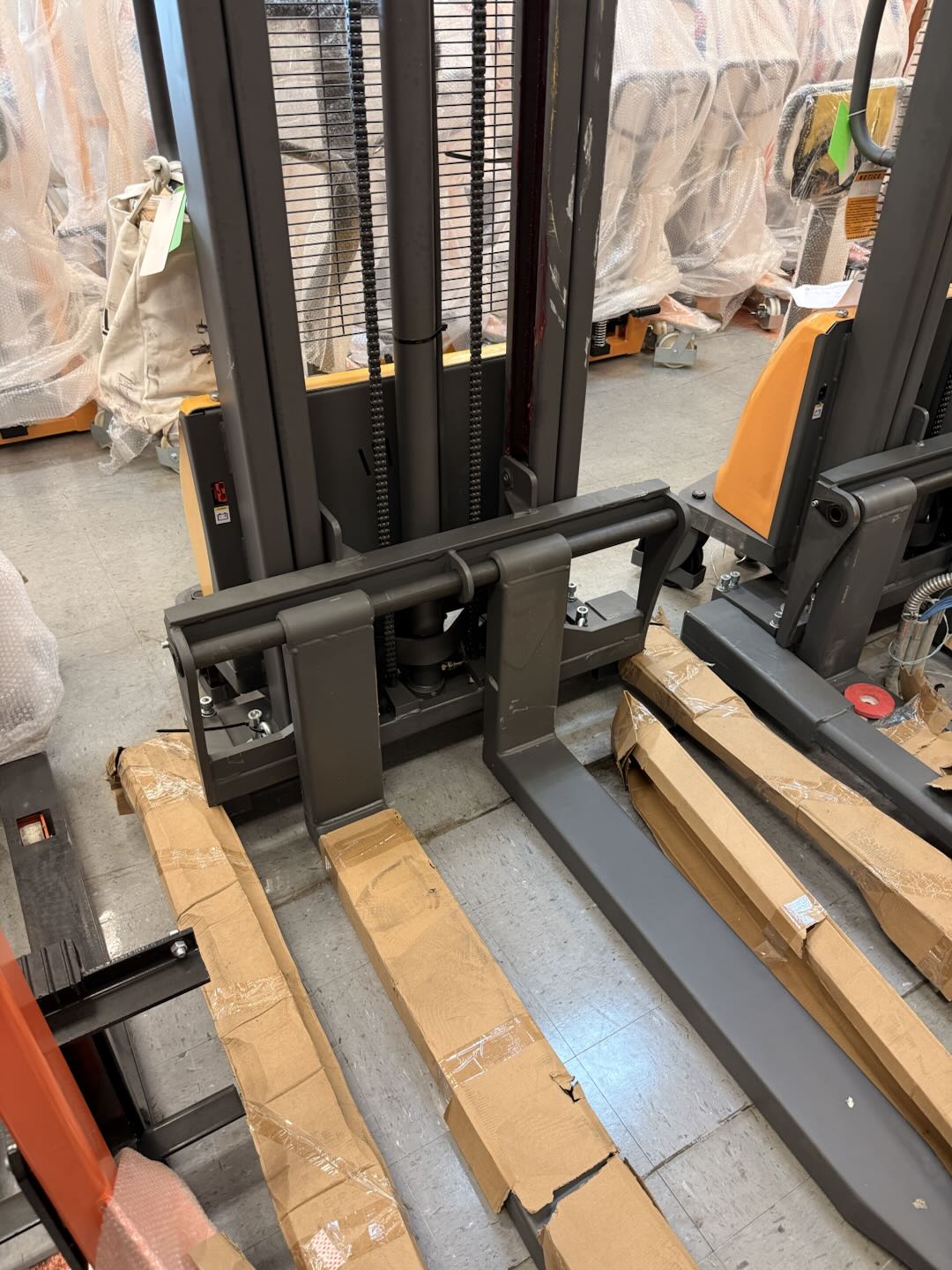 Pre-owned Premium Used CTD10B-III-98–2,200 lb Semi-Electric Stacker, 98" Lift, Straddle Legs & Adjustable Forks-21060112
