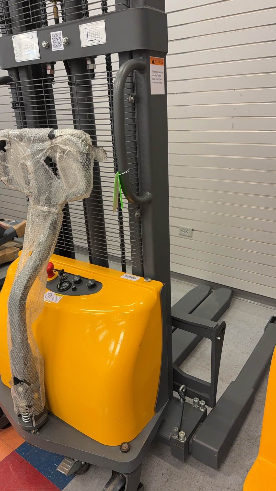 Pre-owned Premium Used CTD10B-III-98–2,200 lb Semi-Electric Stacker, 98" Lift, Straddle Legs & Adjustable Forks-21060116