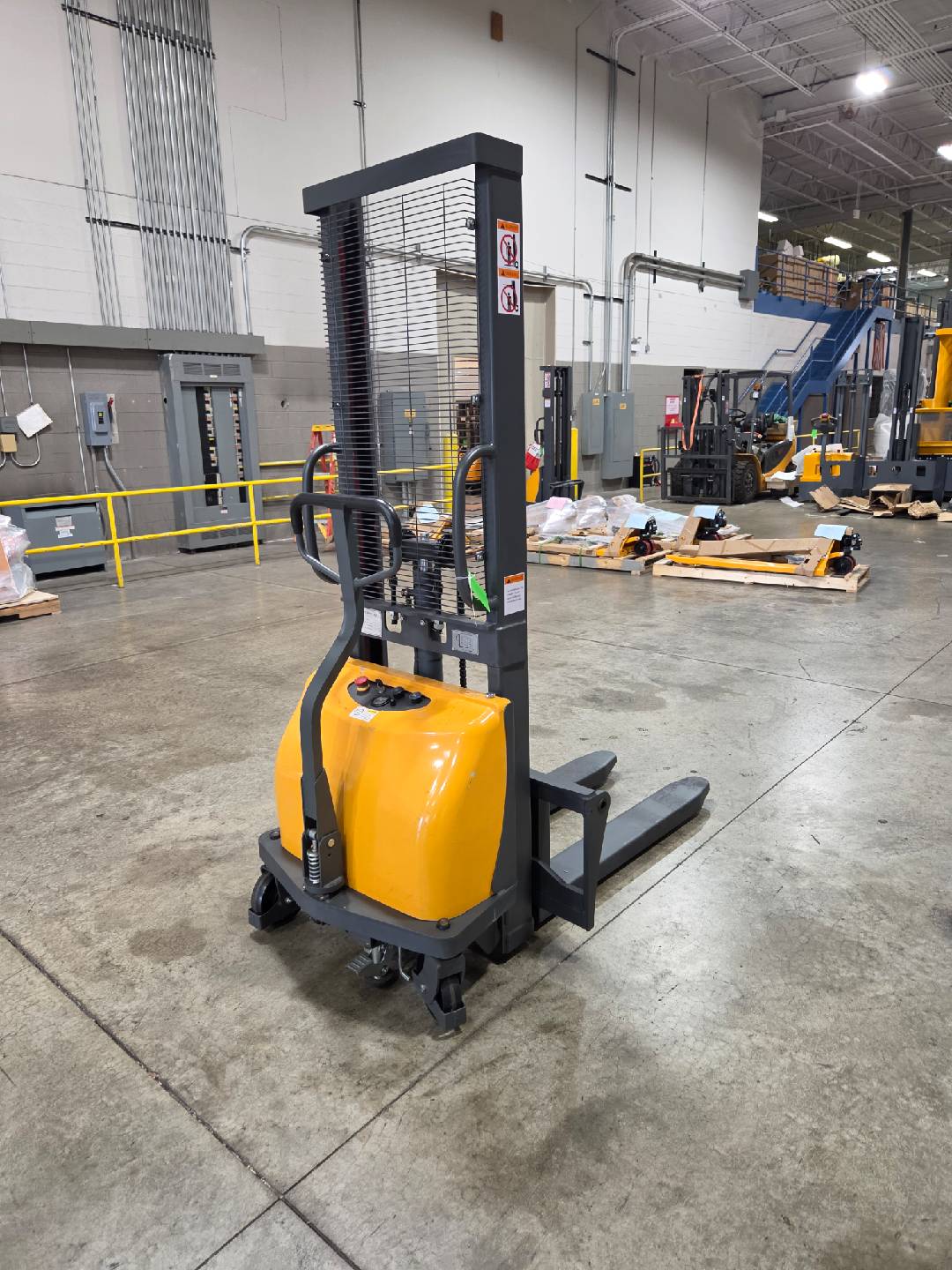 Pre-owned Regular Used CDD10B-III-63–2,200 lb Semi-Electric Stacker, 63" Lift, Fixed Legs & Adjustable Forks-20070650