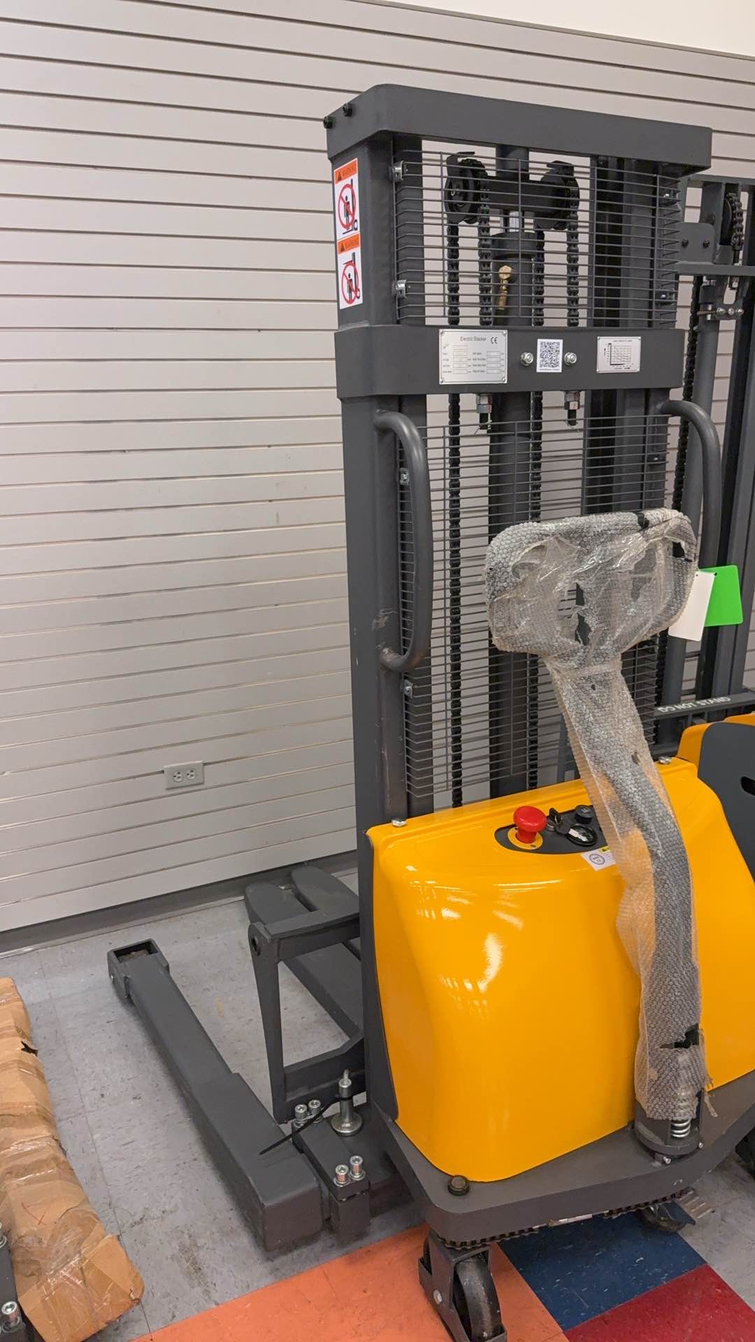 Pre-owned Premium Used CTD10B-III-98–2,200 lb Semi-Electric Stacker, 98" Lift, Straddle Legs & Adjustable Forks-21060116