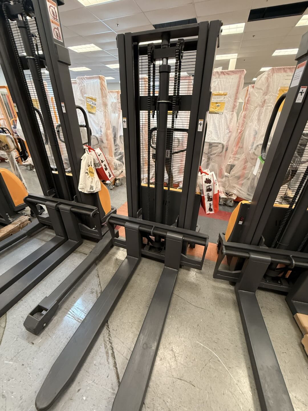 Pre-owned Premium Used CDD10B-III-98–2,200 lb Semi-Electric Stacker, 98" Lift, Fixed Legs & Adjustable Forks-20040382