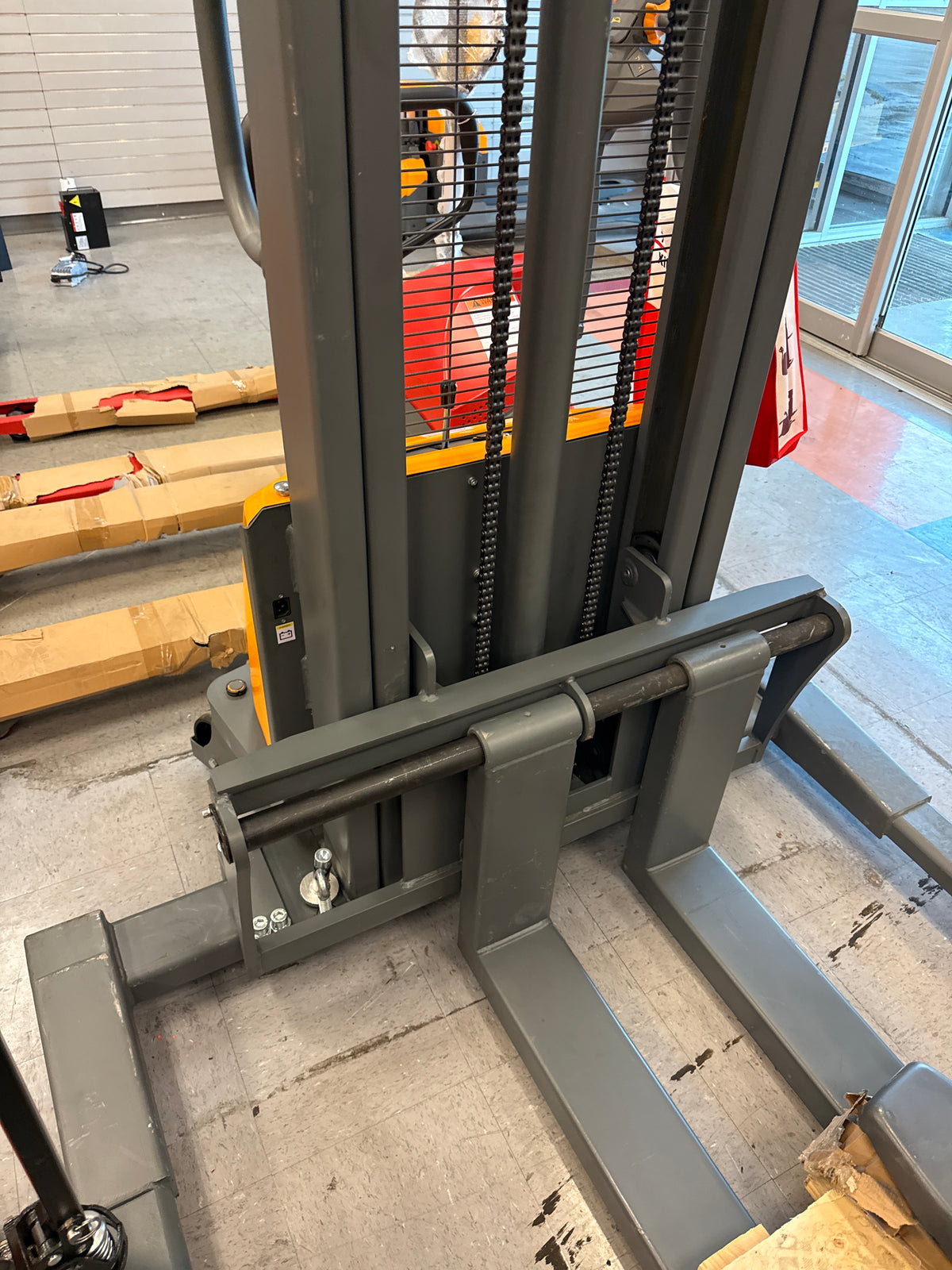 Pre-owned Open Box CTD15BE-118 – 3,300 lb Semi-Electric Stacker, 118" Lift, Straddle Legs & Adjustable Forks-250038322
