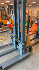 Pre-owned CTD15BE-118 – 3,300 lb Semi-Electric Stacker, 118" Lift, Straddle Legs & Adjustable Forks